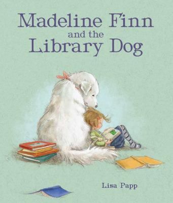 Madeline Finn, a young girl leans across a big white library dog and reads her a book aloud on the book cover "Madeline Finn and the Library Dog" by Lisa Papp, a book on the best Picture books that celebrate reading booklist.